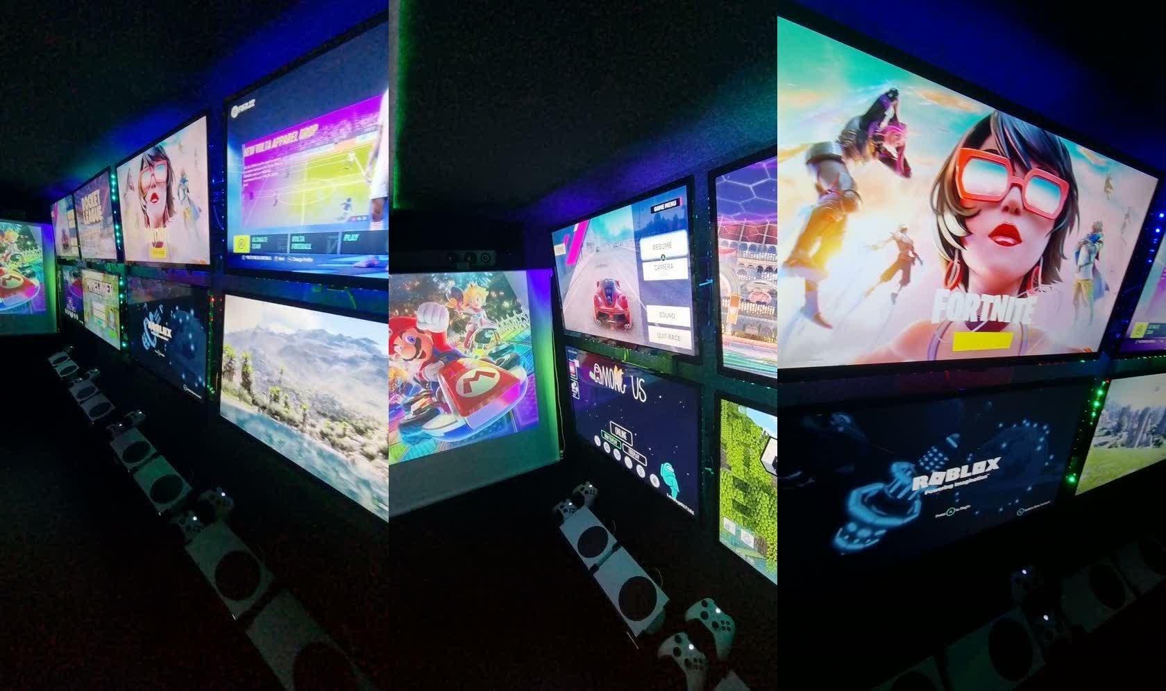 The Level Up screen wall — eight screens live with games