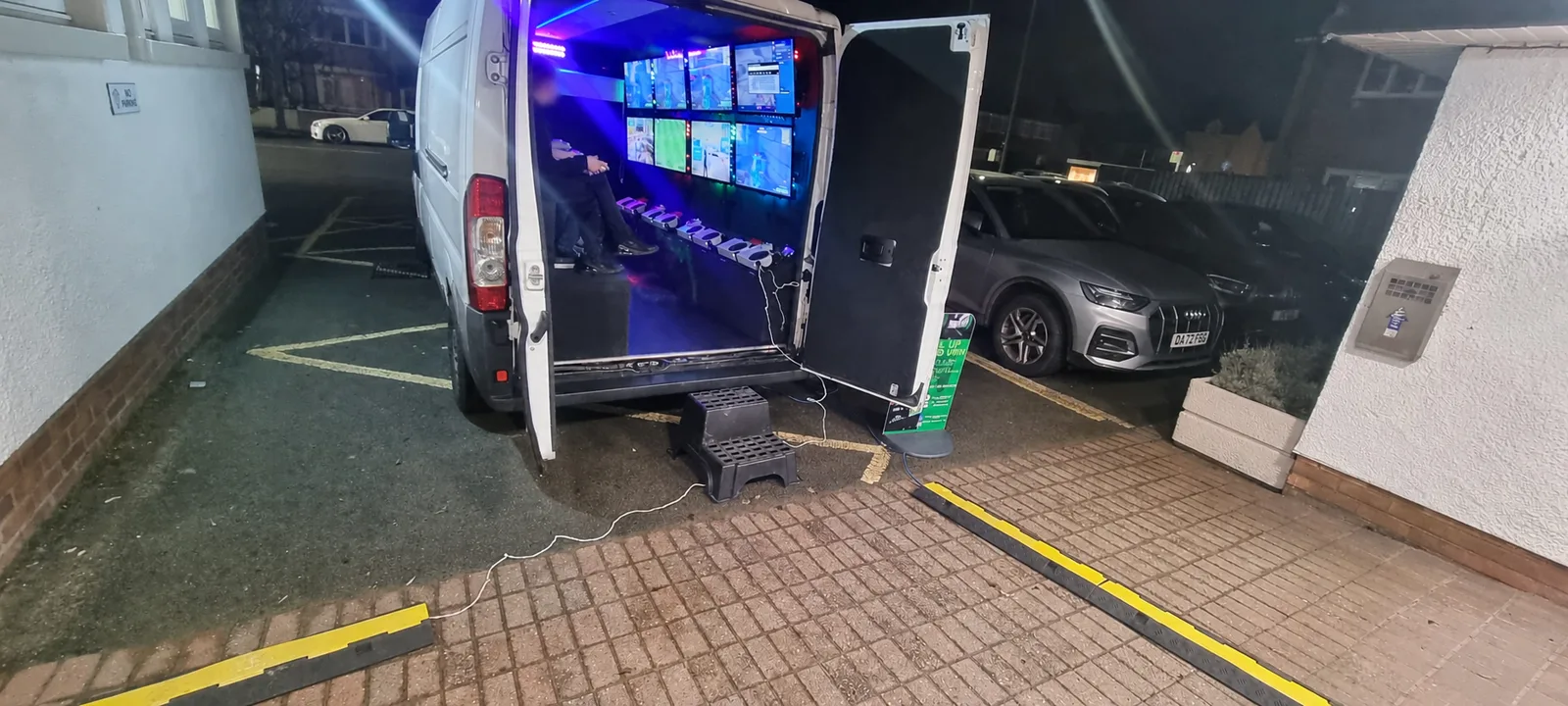 Level Up Gaming Van parked with the rear doors open and gaming screens ready